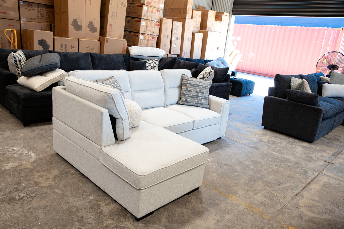 Corner sofa bed with hidden under-seat chaise storage compartment