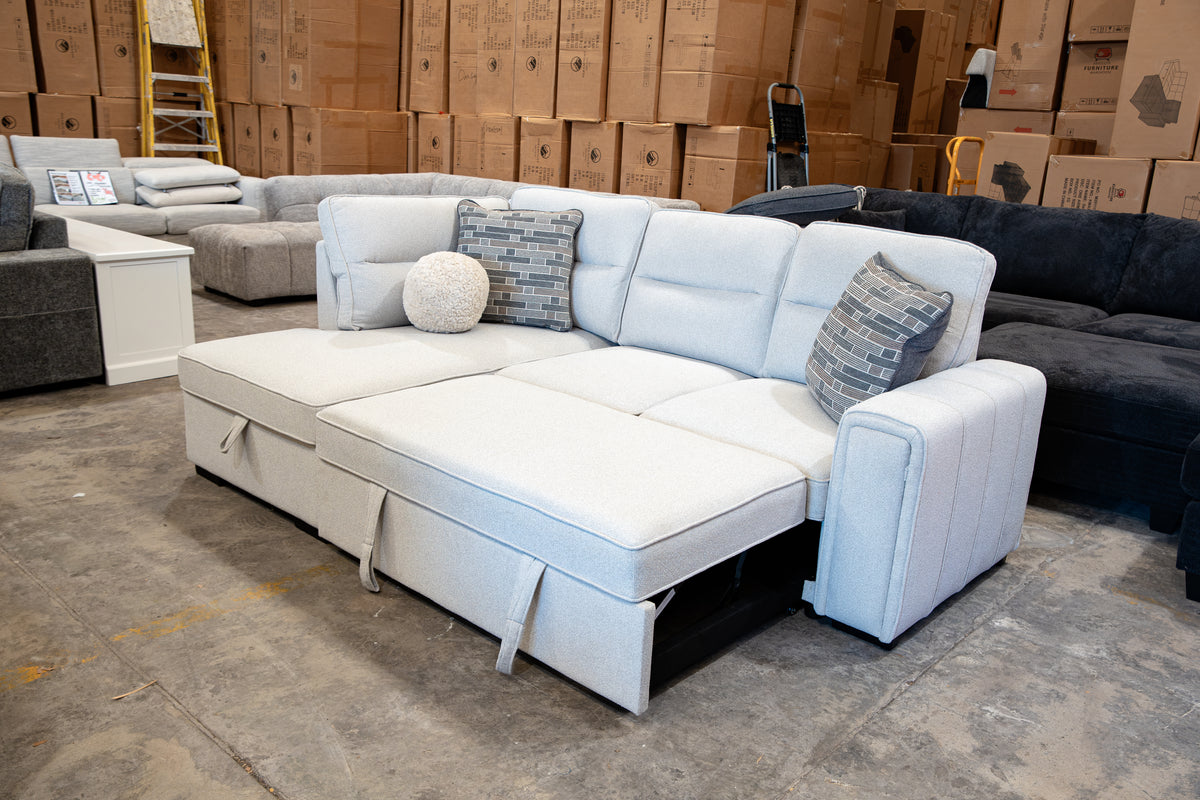 Compact light grey corner sofa bed with plush high-density foam cushioning