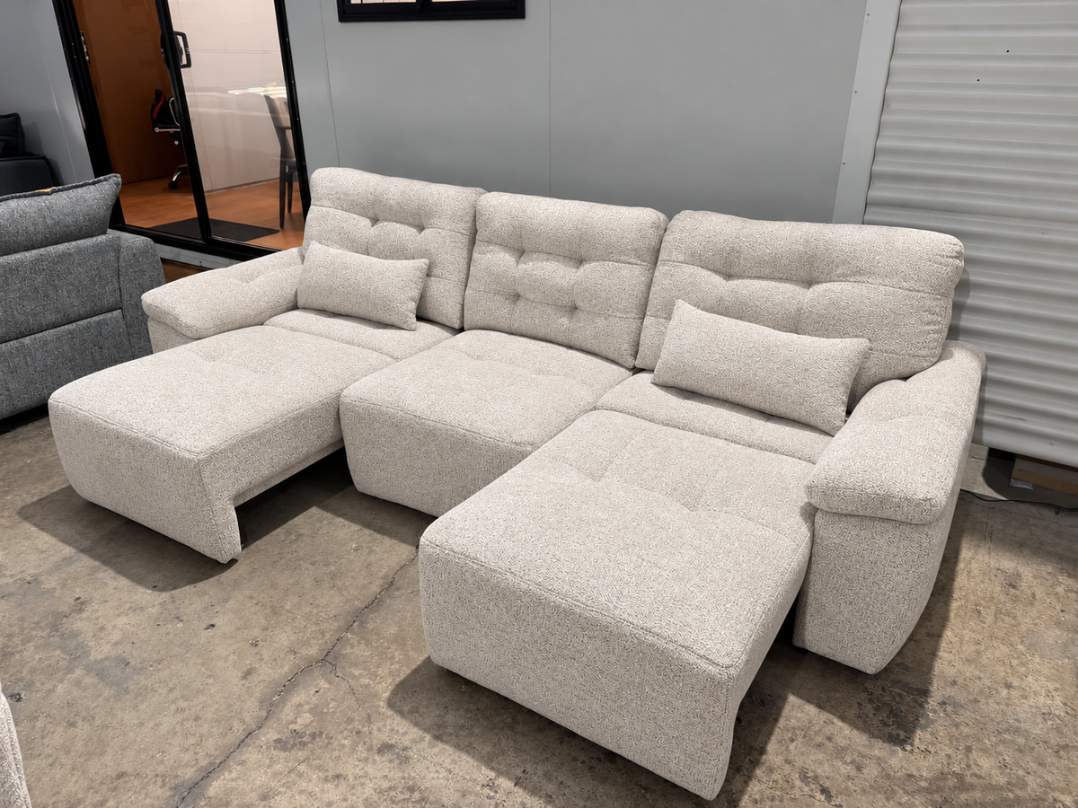 Electric Lounge with Remote Control – Electric sliding fabric lounge with independently adjustable seats operated by remote control for personalised comfort.
