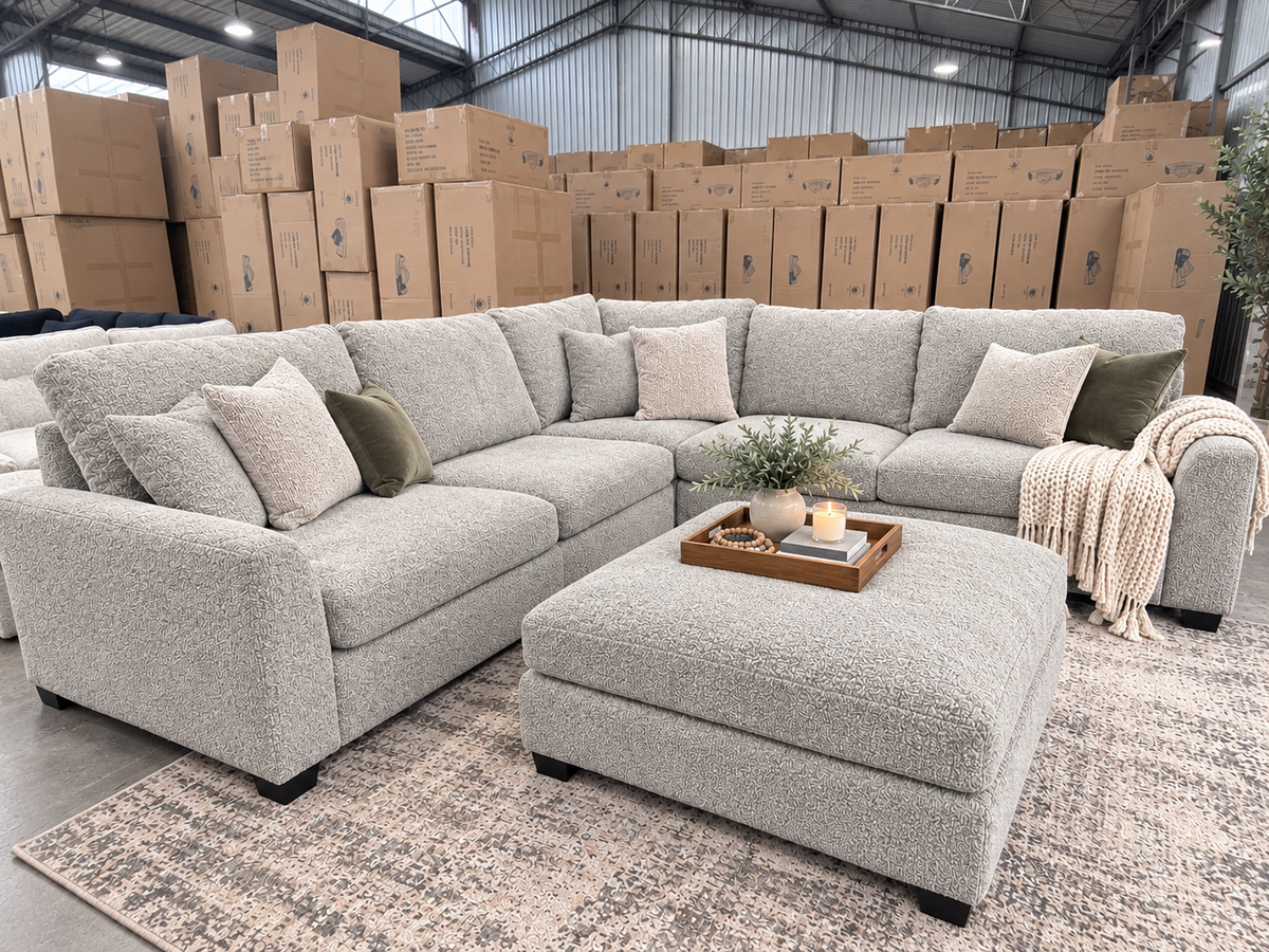 Light grey sectional couch with matching ottoman