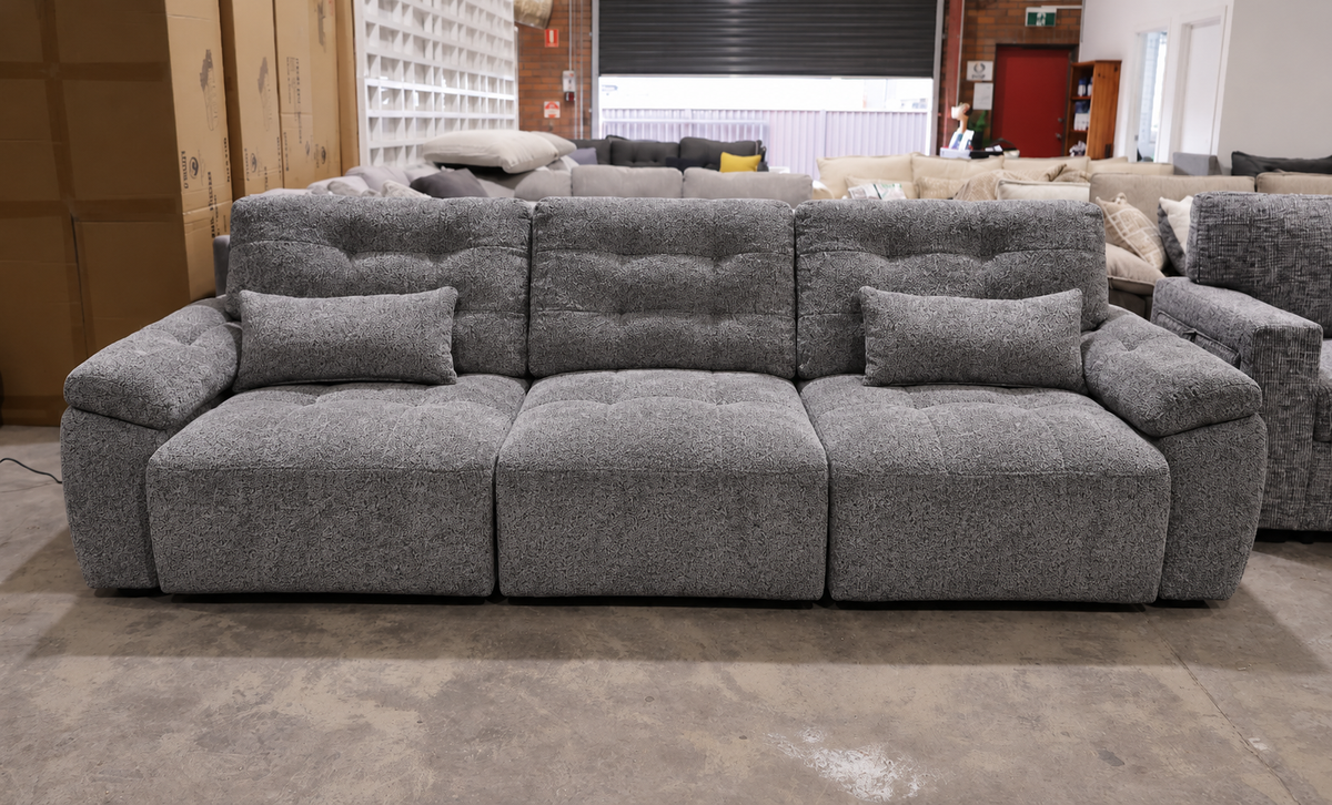 Modern dark grey electric sliding sofa with extended seats creating a spacious lounging area