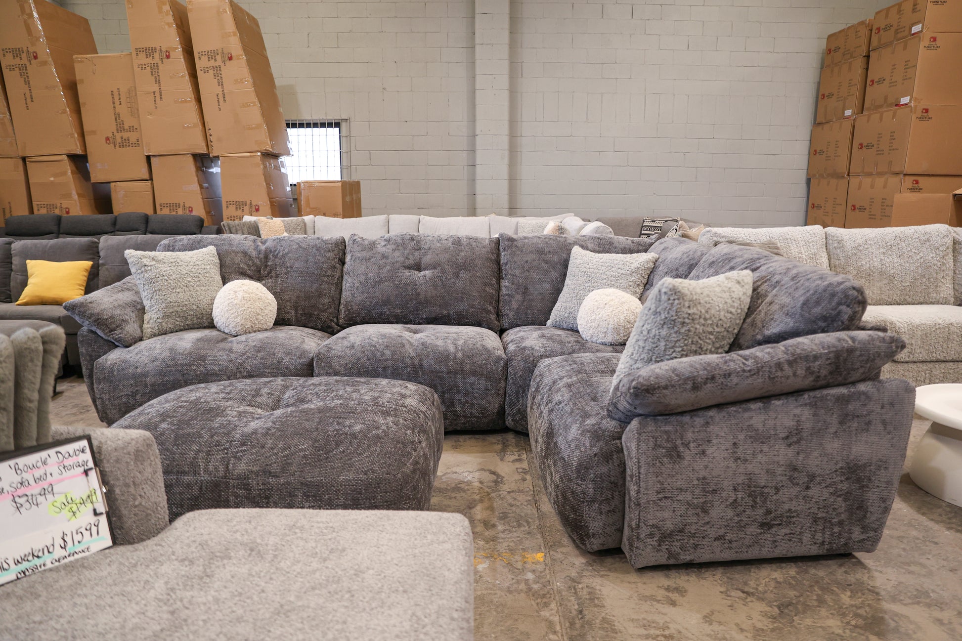 dark grey corner lounge with ottoman. cloud comfort