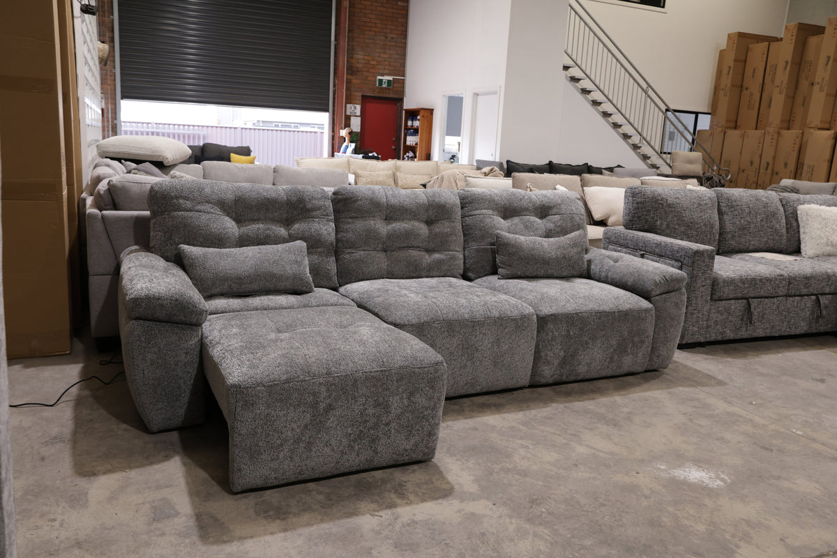 Dark grey electric sliding lounge with remote-controlled seat extensions for personalised comfor